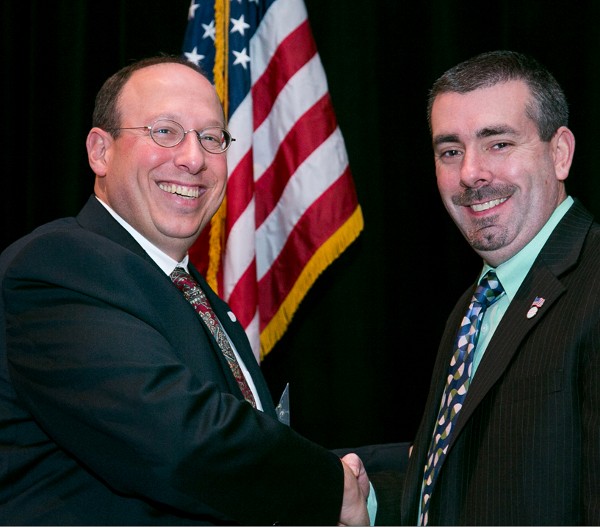 Chris Cusano (l), chapter president, presents the December Young AFCEAN of the Month Award to Rob Stevens, ELEVI Associates LLC.